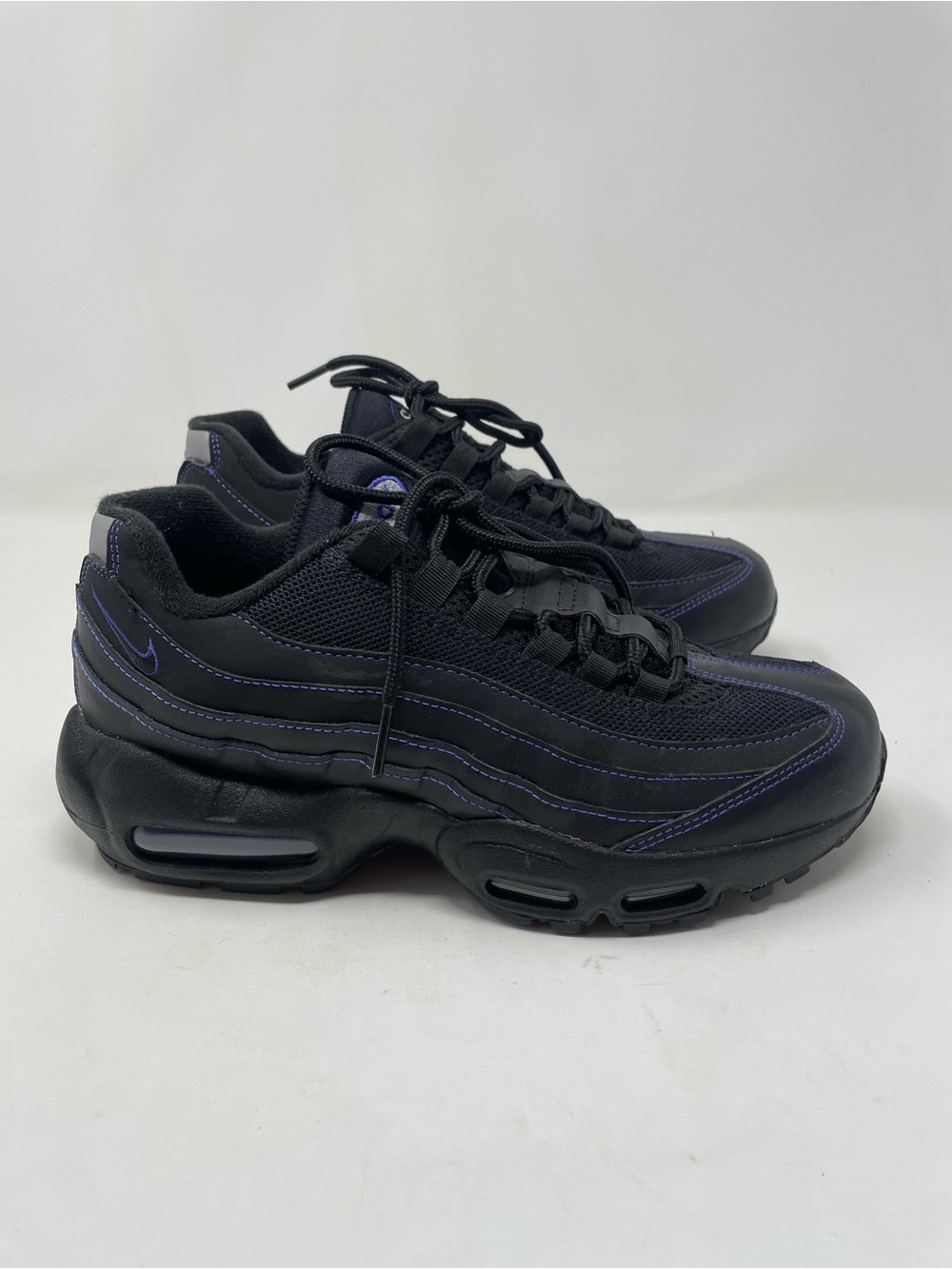 Nike Women's Black Sneakers with Purple Stitching